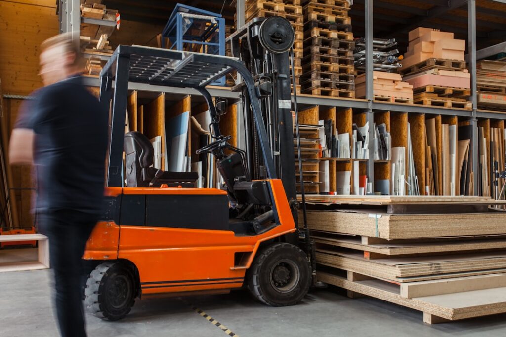 Forklift operating inside a large workshop